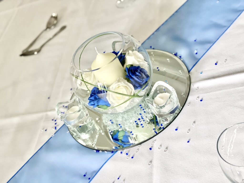 Small Fish Bowl with roses around a long burn candle