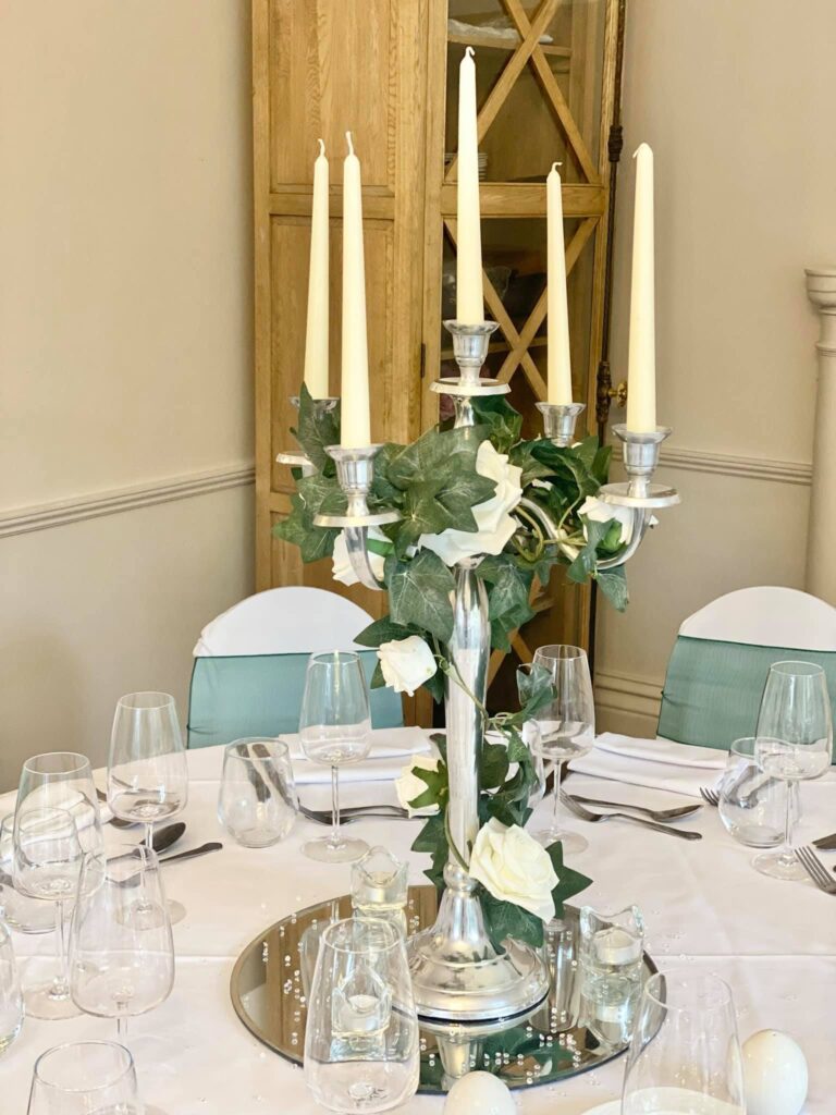 Candelabra with ivy and rose decor