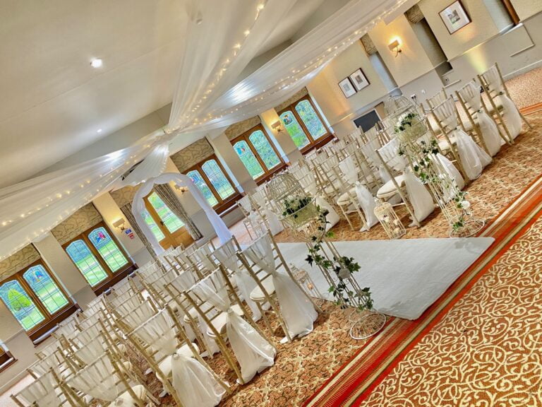 Starlight Wedding Arch - aisle runner - bird cages on pedestals - Ivory Vertical Drop - ceiling draping