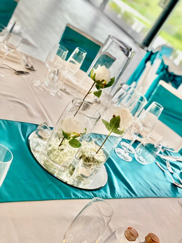 Triple cylinder vases with roses not submerged in water